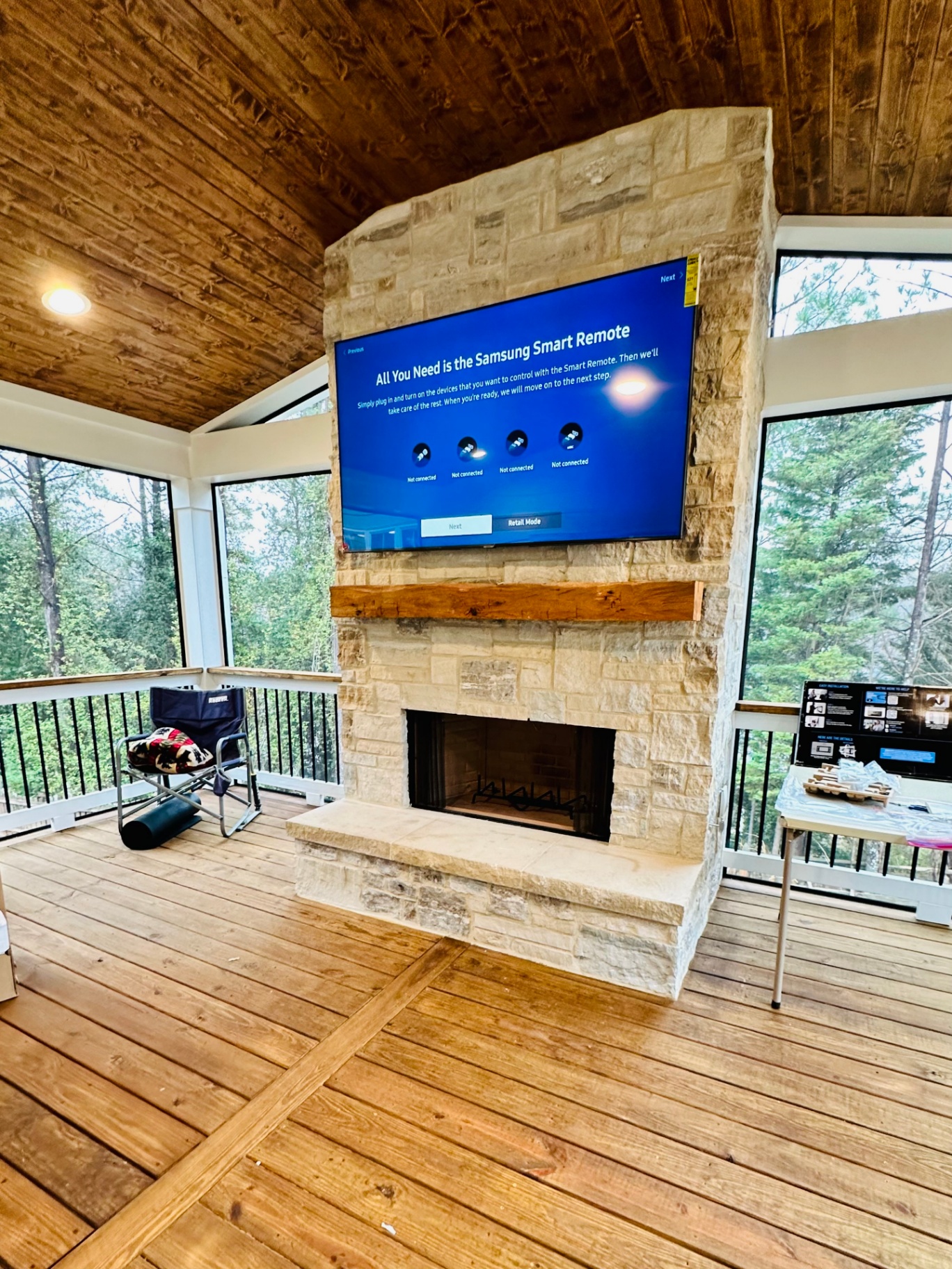65-inch TV mounted on brick fireplace in Douglasville, GA with in-wall wire concealment