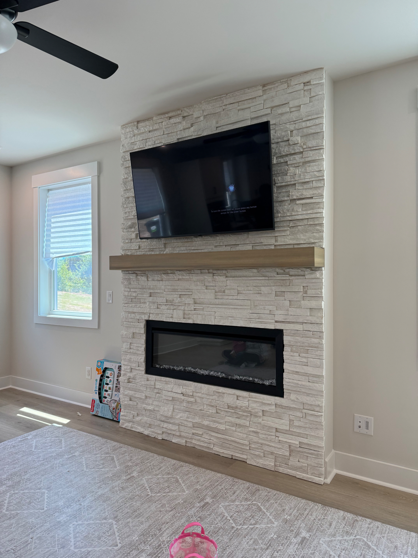 60-inch Full Motion TV installation on Rock Fireplace in Duluth, GA