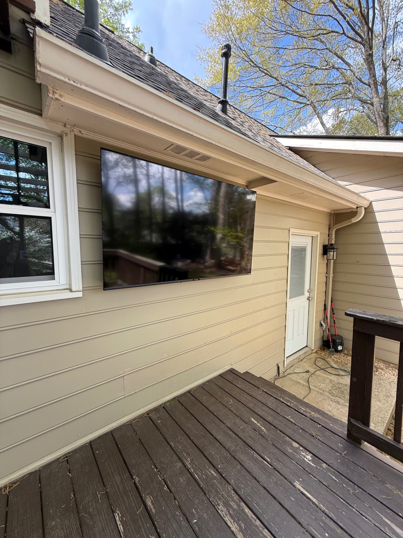 75-inch Full Motion TV installation on Siding in Marietta, GA