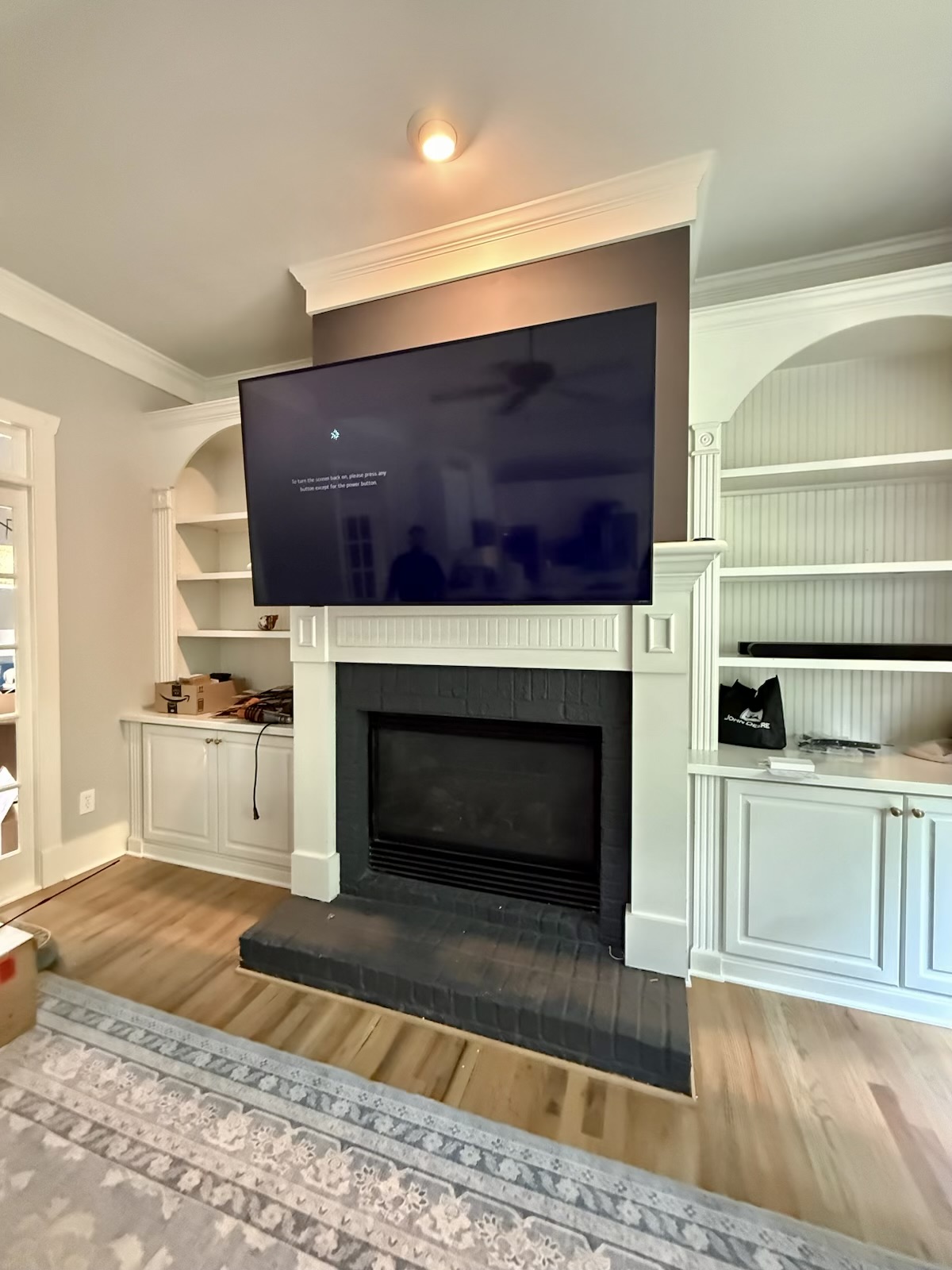 65-inch Pull-Down TV installation on Drywall Fireplace in Sugar Hill, GA