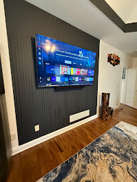 65-inch Full Motion TV installation on Master Bedroom Drywall in Acworth, GA